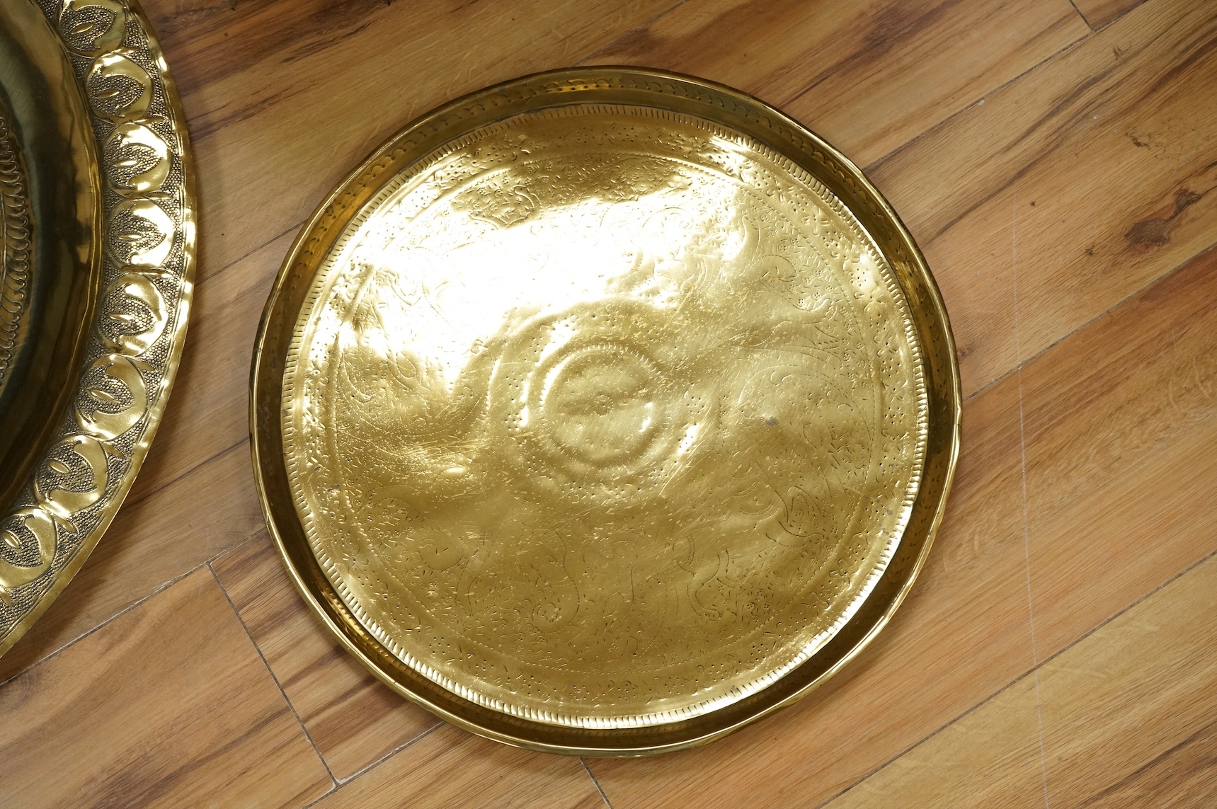 A group of metalware to include brass trays and copper warming pans